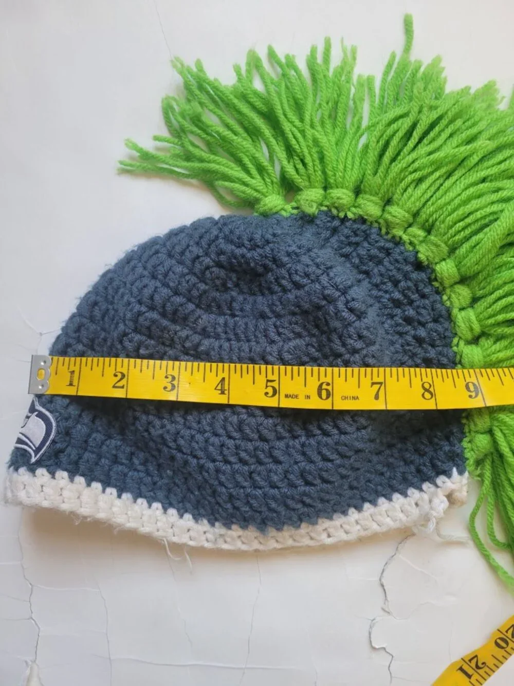 hand-crocheted Seattle Seahawks beanie blue yarn, a white brim, bright green Hat